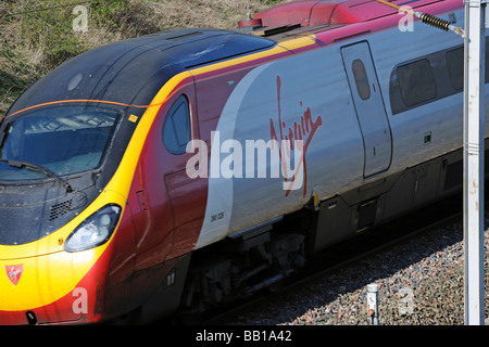British Rail Class 390 ' Pendolino ', electric multiple unit , Number 390 028 ' City of Preston ', at speed . Cumbria, England. Stock Photo