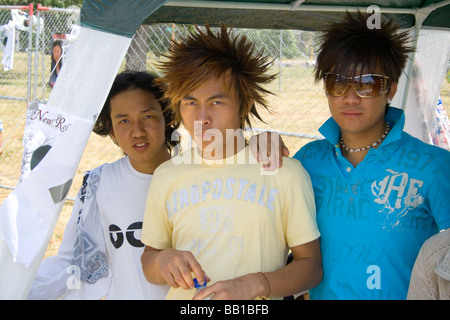 Serious rock band with spiked hair at their booth. Hmong Sports Festival McMurray Field St Paul Minnesota USA Stock Photo