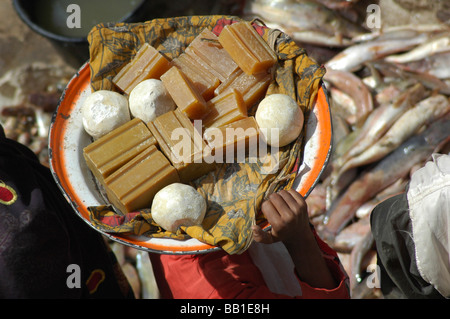 MALI, Mopti. Rooftop view of plates of local products carried by a woman (RF) Stock Photo