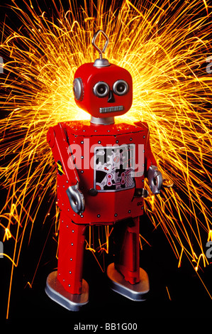 Red toy robot with sparks Stock Photo