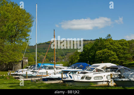 Boats moored at the Swan Hotel Marina, next to the Swan Hotel, Newby Bridge, Lake District National Park, Cumbria, England UK Stock Photo