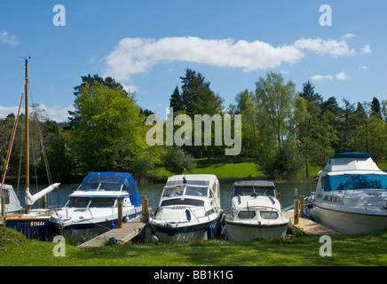 Boats moored at the Swan Hotel Marina, next to the Swan Hotel, Newby Bridge, Lake District National Park, Cumbria, England UK Stock Photo