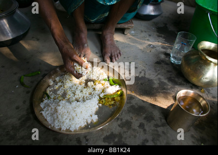 Woman preparing food, rural Bangladesh. Stock Photo