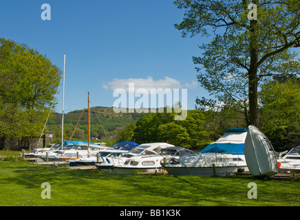 Boats moored at the Swan Hotel Marina, next to the Swan Hotel, Newby Bridge, Lake District National Park, Cumbria, England UK Stock Photo