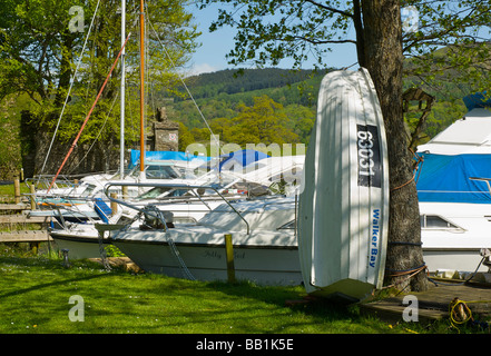 Boats moored at the Swan Hotel Marina, next to the Swan Hotel, Newby Bridge, Lake District National Park, Cumbria, England UK Stock Photo