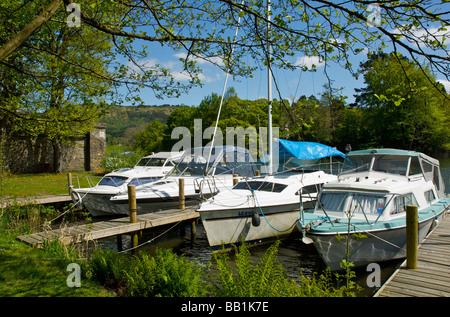 Boats moored at the Swan Hotel Marina, next to the Swan Hotel, Newby Bridge, Lake District National Park, Cumbria, England UK Stock Photo