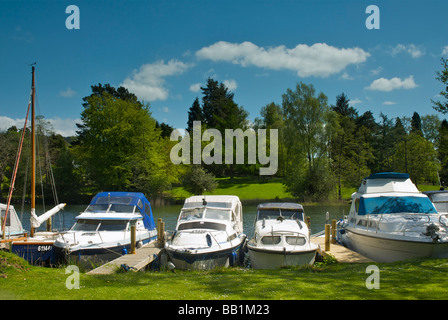 Boats moored at the Swan Hotel Marina, next to the Swan Hotel, Newby Bridge, Lake District National Park, Cumbria, England UK Stock Photo