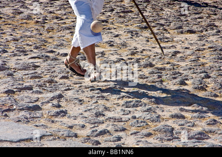 Native man wearing hurache sandal made of leather thongs with car tires for soles demonstrates ball race in Copper Canyon Mexico Stock Photo