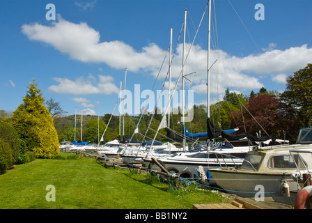 Boats moored at the Swan Hotel Marina, next to the Swan Hotel, Newby Bridge, Lake District National Park, Cumbria, England UK Stock Photo