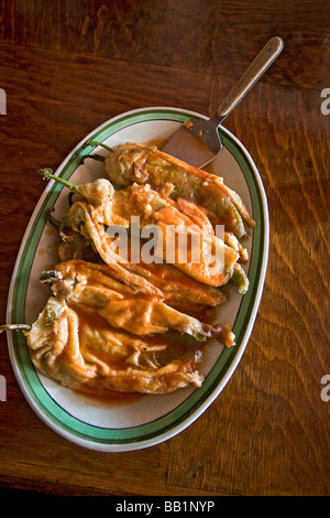 Chiles rellenos a dish made with large chiles that are stuffed with cheese coated with batter and fried Mexico Stock Photo