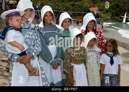 Young women and girls in traditional costume and bonnets Saint Louis Festival Corossol St Barts Stock Photo