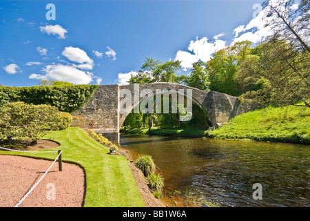 Medieval Brig O’Doon at the Burns National Heritage Park in Alloway Scotland spanning the River Doon Stock Photo