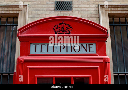 Close-up shot taken of the top of a traditional red telephone box in London Stock Photo