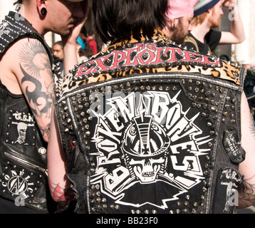 Space Hijackers MayDay protest at Bank .Young man wearing a leather jacket with Broken Bones and Exploited written on it. Stock Photo
