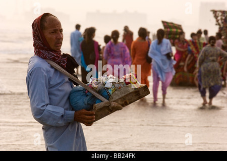 Pakistani s enjoying the camels and the sea on Clifton beach Karachi Pakistan Stock Photo