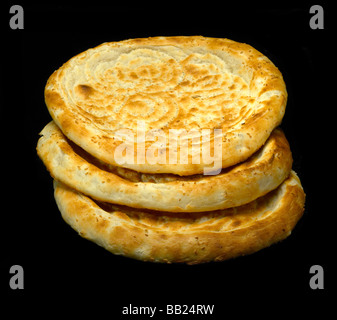 original fresh uzbek bread isolated over black background Stock Photo