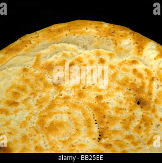 original fresh uzbek bread isolated over black background Stock Photo