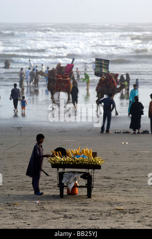 Pakistani s enjoying the camels and the sea on Clifton beach Karachi Pakistan Stock Photo