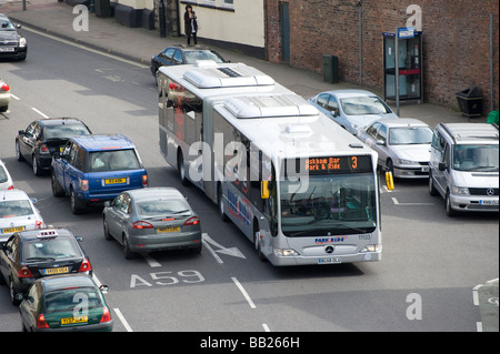 Silver bendy bus on a park and ride service in York city centre England Stock Photo