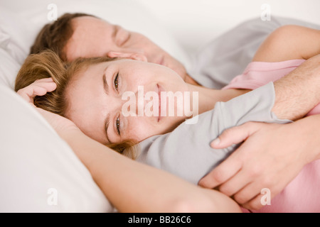 Couple sleeping on the bed Stock Photo