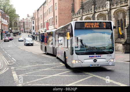 Silver bendy bus on a park and ride service in York city centre England Stock Photo