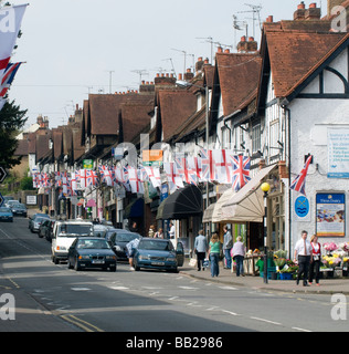 ST GEORGE FLAGS AND UNION FLAGS, DISPLAYED ON ST.GEORGE'S DAY,  CHALFONT ST PETER IN BUCKINGHAMSHIRE Stock Photo