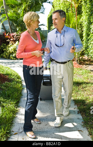 Couple looking at each other and walking Stock Photo