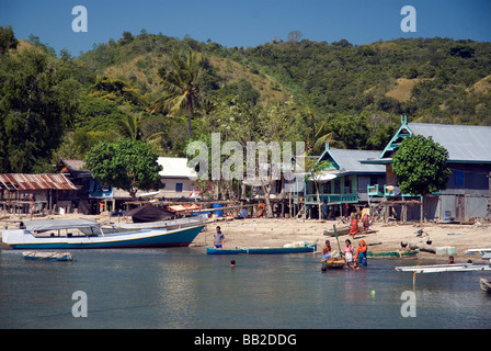 The people of Kampong Rinca live their daily lives in a state of near siege due to the island's voracious dragons Stock Photo