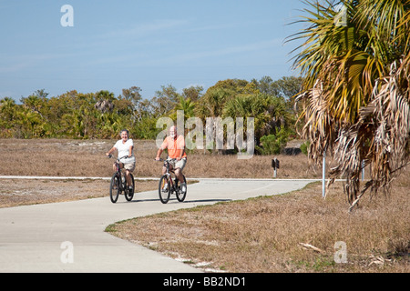 Active senior couple riding their bicycles on a beautiful sunny day  Stock Photo