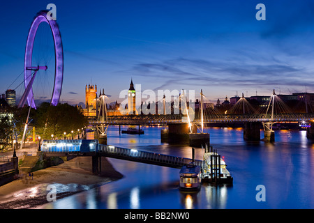 london skyline at night showing the London eye The Houses of Parliament and the River Thames Stock Photo