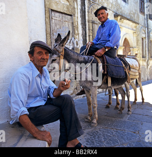 Donkey Owners Lindos Rhodes Greek islands Hellas Stock Photo