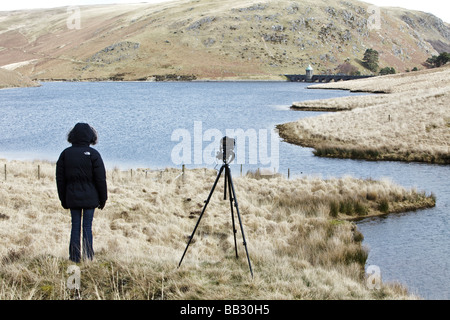 photographer in the landscape photographing Stock Photo