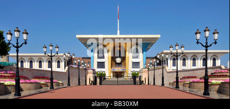 Muscat Oman gates & front of the opulent Al Alam Sultans Palace building and red tarmac approach road Gulf of Oman Middle East Stock Photo