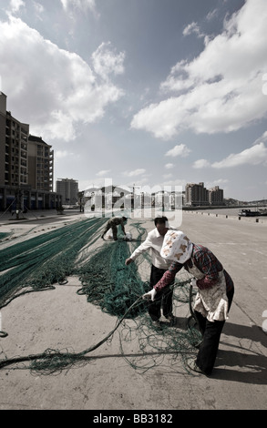 China, Zhoushan Prefecture, Shengsi Islands, Sijiao Island. Fishing nets, fishermen. Stock Photo