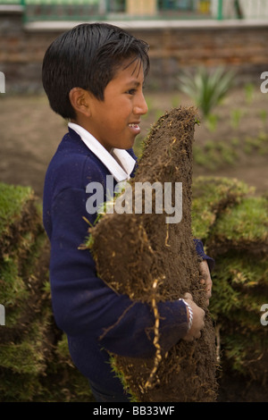 South America, Ecuador, Lasso, school children doing community service project at church garden Stock Photo