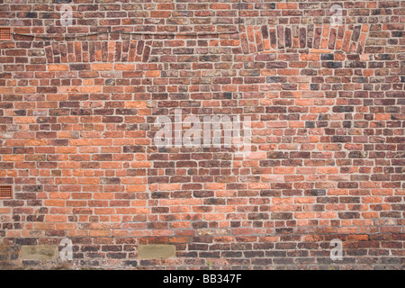 Brick wall with bricked up windows. Styal, Cheshire, United Kingdom. Stock Photo