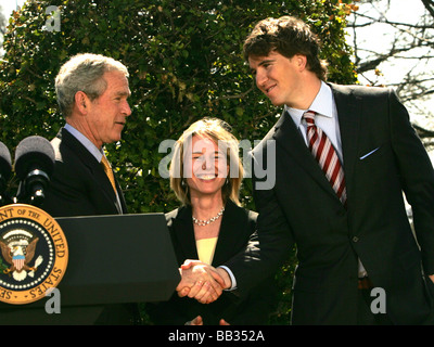 President George W. Bush shakes hands with NY Giants quarteback Eli Manning in the Kennedy Garden