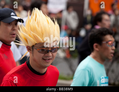 Funny marathon runners in costumes during the 2009 Tokyo Marathon. Stock Photo