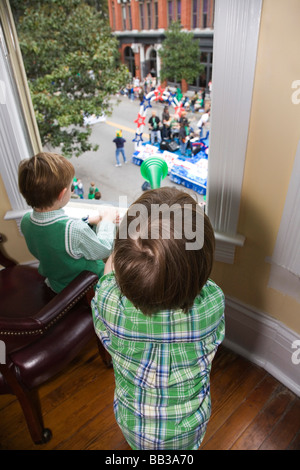 USA; Georgia; Savannah.  Two young boys watching the St. Patrick's Day Parade.(MR) Stock Photo