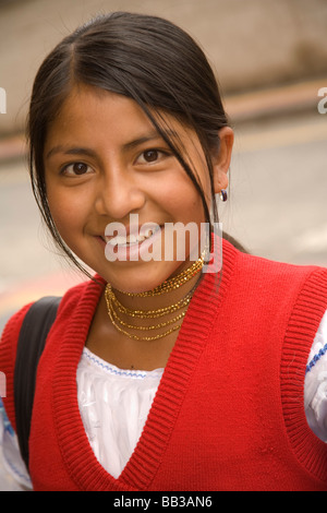 South America, Ecuador, Otavalo,  teenage girl in school uniform walking home from school Stock Photo