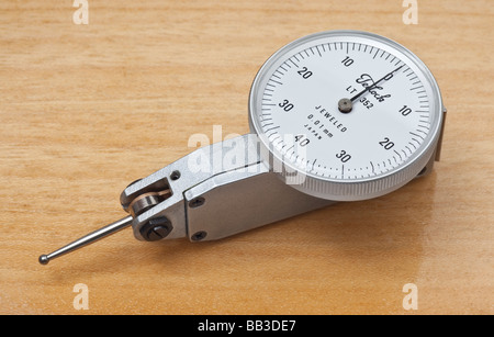 DTI dial gauge workshop engineering measurement tool on pine wood background Stock Photo