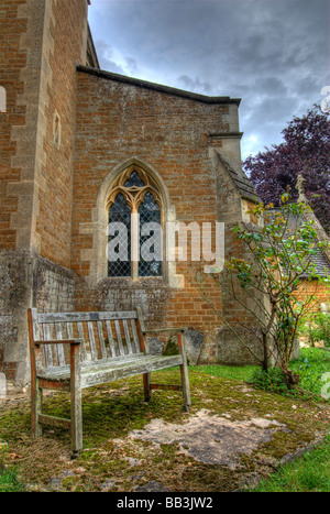 Bench outside the church Stock Photo