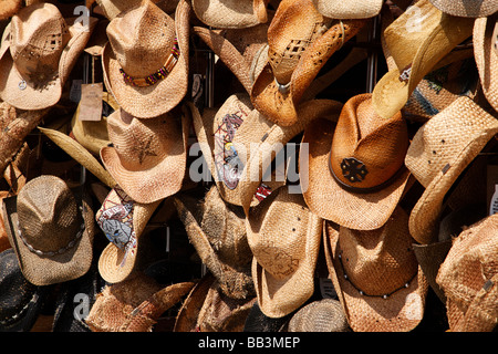 straw hats for sale in a tourist shop on ocean front walk venice bench california usa Stock Photo