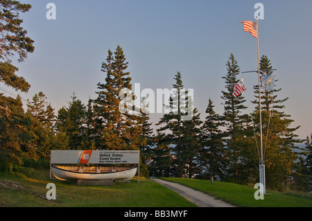 North America, USA, Maine, Tremont, Bass Harbor.  Coast Guard Sign and rowboat near Bass Harbor Head Light. Stock Photo
