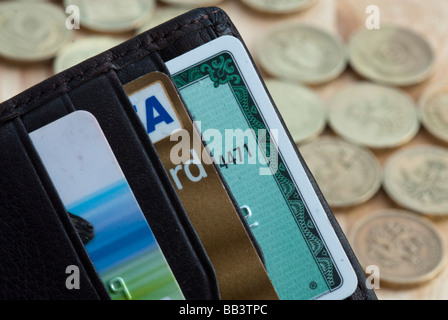 Credit cards with money in wallet on world map background Stock Photo ...