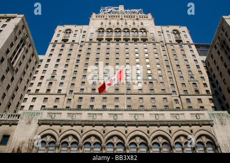 Canada, Ontario, Toronto. Close-up of Fairmont Royal York Hotel flying the Canadian flag. Stock Photo