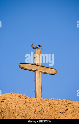 NA, USA, New Mexico, Las Trampas, Church of San Jose de Gracia, Close-up of Wooden Cross on Adobe Wall (RF) Stock Photo