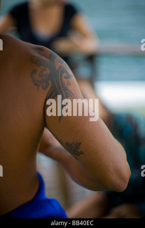 Muscular tattoed brazilian on a diving boat. Stock Photo