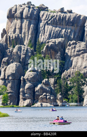 USA, South Dakota, Custer State Park. People run paddle boats on Sylvan Lake. Stock Photo