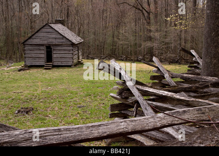 USA, Tennessee, Great Smoky Mountains National Park. Abandoned cabin and old wooden rail fence. Stock Photo